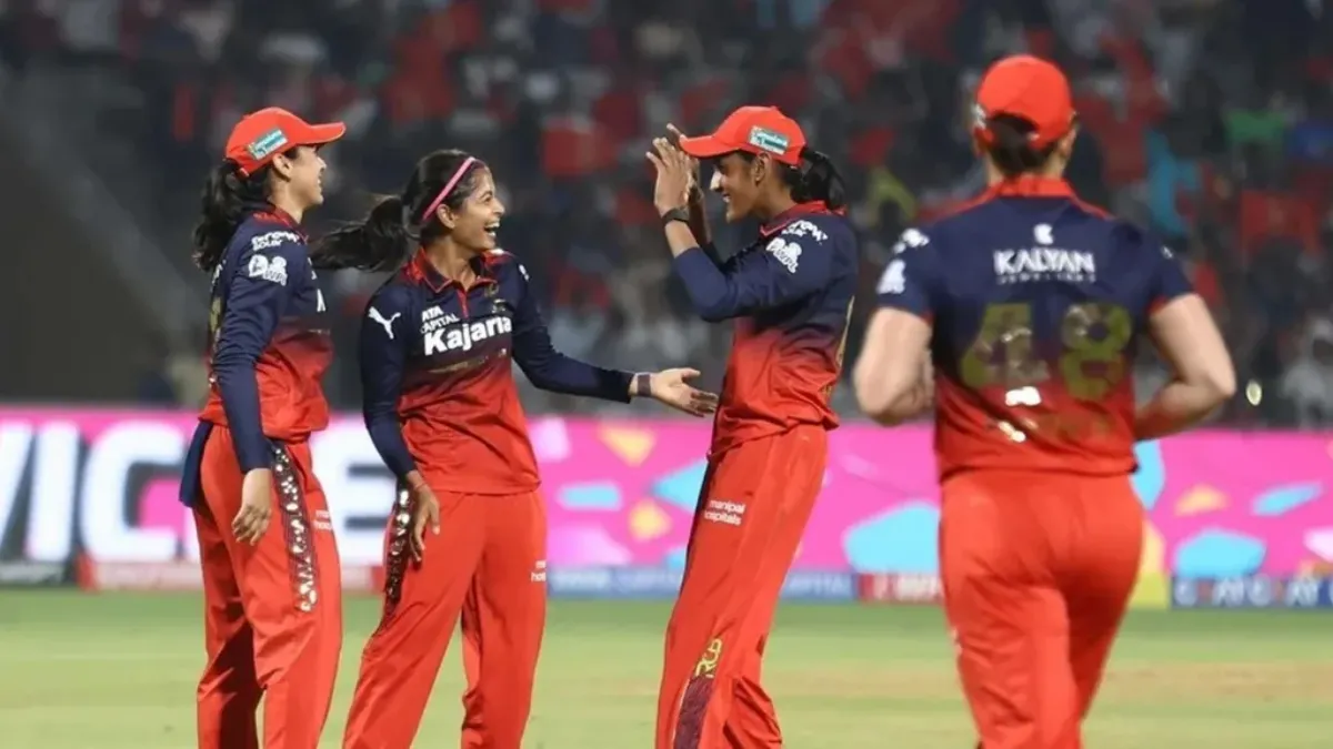 The RCB team celebrating a disimissal against UPW in the WPL match in Navi Mumbai